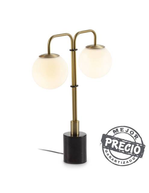 Elegante lámpara de sobremesa de metal acabado dorado y pie cilíndrico de mármol negro.