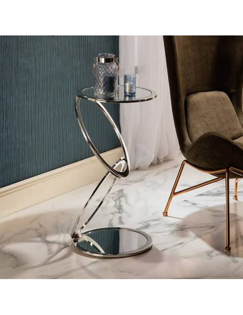 Elegancia, diseño e innovación definen la mesa auxiliar espejo saturno elaborada con acero acabado brillo.